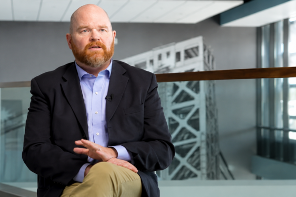man being interviewed in office